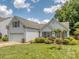 Exterior shot of home showcasing landscaping, garage, and traditional architectural style at 3066 Orion Dr, Fort Mill, SC 29707