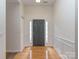 Inviting foyer with hardwood floors, decorative molding, and a view of the front door at 3066 Orion Dr, Fort Mill, SC 29707