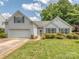 Charming home with a lush lawn, manicured landscaping, and a welcoming front entrance at 3066 Orion Dr, Fort Mill, SC 29707