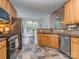 Well-lit kitchen features stainless steel appliances, granite countertops, and decorative tile flooring at 3066 Orion Dr, Fort Mill, SC 29707