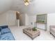 Spacious living room showcasing a comfortable seating area with a woven coffee table and neutral decor at 3066 Orion Dr, Fort Mill, SC 29707