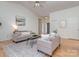 Open-concept living room featuring hardwood floors, neutral décor, and comfortable seating at 3066 Orion Dr, Fort Mill, SC 29707