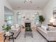Bright living room featuring a fireplace, large windows, and stylish furniture at 3066 Orion Dr, Fort Mill, SC 29707