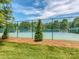 This well-maintained community tennis court has a new surface, surrounded by a secure fence and beautiful landscaping at 3066 Orion Dr, Fort Mill, SC 29707