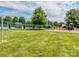 The community volleyball court is situated on a lush green lawn, with playground and tennis court nearby at 3066 Orion Dr, Fort Mill, SC 29707