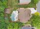 Expansive aerial view of the property showcasing a well-maintained house with a large pool and landscaped yard at 310 E Waterlynn Rd, Mooresville, NC 28115
