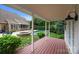 Inviting backyard with wooden deck overlooking a luxurious pool and jacuzzi, perfect for outdoor relaxation at 310 E Waterlynn Rd, Mooresville, NC 28115