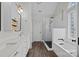 Bright bathroom showcasing double vanities with quartz countertops and a separate tub and shower at 310 E Waterlynn Rd, Mooresville, NC 28115