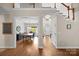 Elegant foyer showcasing hardwood floors and open access to the dining room and staircase at 310 E Waterlynn Rd, Mooresville, NC 28115