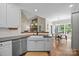 Charming kitchen with white cabinets and stainless appliances at 310 E Waterlynn Rd, Mooresville, NC 28115