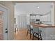 Well-equipped kitchen with white cabinets and a breakfast bar at 310 E Waterlynn Rd, Mooresville, NC 28115