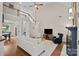 Spacious living room with a fireplace, hardwood floors, and staircase at 310 E Waterlynn Rd, Mooresville, NC 28115