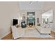 Bright living room features a fireplace and hardwood floors at 310 E Waterlynn Rd, Mooresville, NC 28115