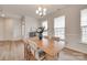 Bright dining room featuring hardwood floors and three windows with natural light at 3101 Virginia Trail Ct, Fort Mill, SC 29715