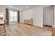 Well-lit dining room featuring wood floors, modern furniture, and neutral decor at 3101 Virginia Trail Ct, Fort Mill, SC 29715