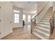 Bright entryway with hardwood floors, a staircase, and natural light from the front door at 3101 Virginia Trail Ct, Fort Mill, SC 29715