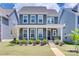 Charming two-story home with a covered front porch and manicured lawn at 3101 Virginia Trail Ct, Fort Mill, SC 29715