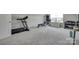 Spacious home gym with carpeted floors, modern equipment and natural light at 3101 Virginia Trail Ct, Fort Mill, SC 29715
