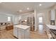 Modern kitchen with gray cabinets, stainless steel appliances and an island with a white countertop at 3101 Virginia Trail Ct, Fort Mill, SC 29715