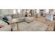 Bright, open-concept living space with wood floors, cozy furniture, and a modern kitchen at 3101 Virginia Trail Ct, Fort Mill, SC 29715