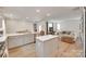 An open floor plan showcases the kitchen island, countertops, and a cozy living room area at 3101 Virginia Trail Ct, Fort Mill, SC 29715