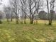 Backyard featuring grass, many trees and a meadow ready for your enjoyment at 3103 Blue Ridge Dr, Shelby, NC 28150