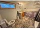 Bathroom renovation in progress, featuring a sink, toilet, and window at 3103 Blue Ridge Dr, Shelby, NC 28150