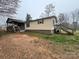 Charming exterior view of a single-story home with an inviting wooden porch and staircase at 3103 Blue Ridge Dr, Shelby, NC 28150