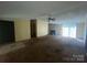 Spacious living room featuring a stone fireplace, ceiling fan, and sliding glass doors at 3103 Blue Ridge Dr, Shelby, NC 28150