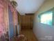 Unfinished room; ready for your custom touch with visible framing and insulation at 3103 Blue Ridge Dr, Shelby, NC 28150