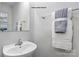 A bathroom featuring a modern vanity with a sink and mirror, complemented by decorative towels and wall art at 336 Maplestead St # 1080, Lancaster, SC 29720