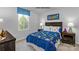 Bedroom with a wooden bed frame, side tables, carpet floors, natural light, and playful decor at 336 Maplestead St # 1080, Lancaster, SC 29720