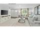 A living room featuring neutral walls, carpet flooring, comfortable seating, and bright natural light at 336 Maplestead St # 1080, Lancaster, SC 29720