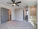 Comfortable bedroom with gray carpet, ceiling fan, and ensuite bathroom at 3439 Stags Leap Way, York, SC 29745