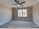 Bedroom featuring neutral carpeting, trim detail, and a window at 3439 Stags Leap Way, York, SC 29745