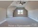 Large bonus room with neutral carpeting, ceiling fan, and dormer window at 3439 Stags Leap Way, York, SC 29745