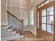 Welcoming foyer with a staircase, wood flooring, and a beautiful front door with glass panels at 3439 Stags Leap Way, York, SC 29745