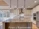 Kitchen island featuring granite countertop, pendant lights, and stainless-steel appliances at 3439 Stags Leap Way, York, SC 29745
