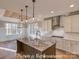 Kitchen features a center island, granite countertops, pendant lights and stainless-steel appliances at 3439 Stags Leap Way, York, SC 29745
