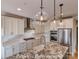 Gourmet kitchen features stainless steel appliances and a large center island with stone countertops at 3439 Stags Leap Way, York, SC 29745
