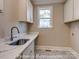 Functional laundry room with sink, countertops, and cabinetry for storage at 3439 Stags Leap Way, York, SC 29745