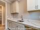 Well-lit laundry room with countertops, sink, and storage, conveniently located near the other rooms at 3439 Stags Leap Way, York, SC 29745