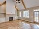 A spacious living room with stone fireplace, built-in cabinets, wood floors and cathedral ceiling at 3439 Stags Leap Way, York, SC 29745