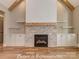 Living room features stone fireplace, wood mantel, built-in cabinets and hardwood floors at 3439 Stags Leap Way, York, SC 29745