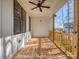 Inviting outdoor porch with wood flooring and ceiling fan, perfect for relaxing at 3439 Stags Leap Way, York, SC 29745