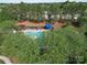 Aerial view of the community pool surrounded by mature trees at 3446 Broadwick St, Charlotte, NC 28213