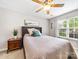 Comfortable bedroom with a ceiling fan, a window, carpet, and neutral decor at 3446 Broadwick St, Charlotte, NC 28213