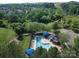 An aerial view of the community pool and surrounding mature landscaping and trees at 3446 Broadwick St, Charlotte, NC 28213