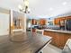 Open kitchen with a dining area, modern appliances, wood cabinets, and seamless flow at 3446 Broadwick St, Charlotte, NC 28213