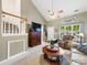 Cozy living room boasts vaulted ceiling, fan, large window, and comfortable furnishings at 3446 Broadwick St, Charlotte, NC 28213